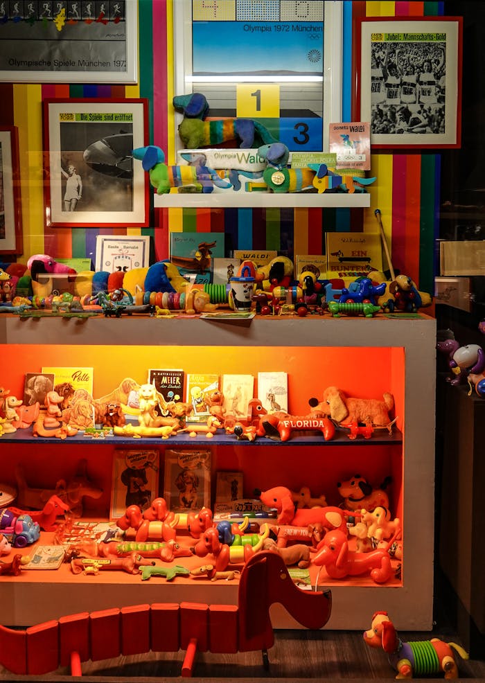 Colorful vintage toy store display featuring playful figurines and souvenirs in Passau, Germany.